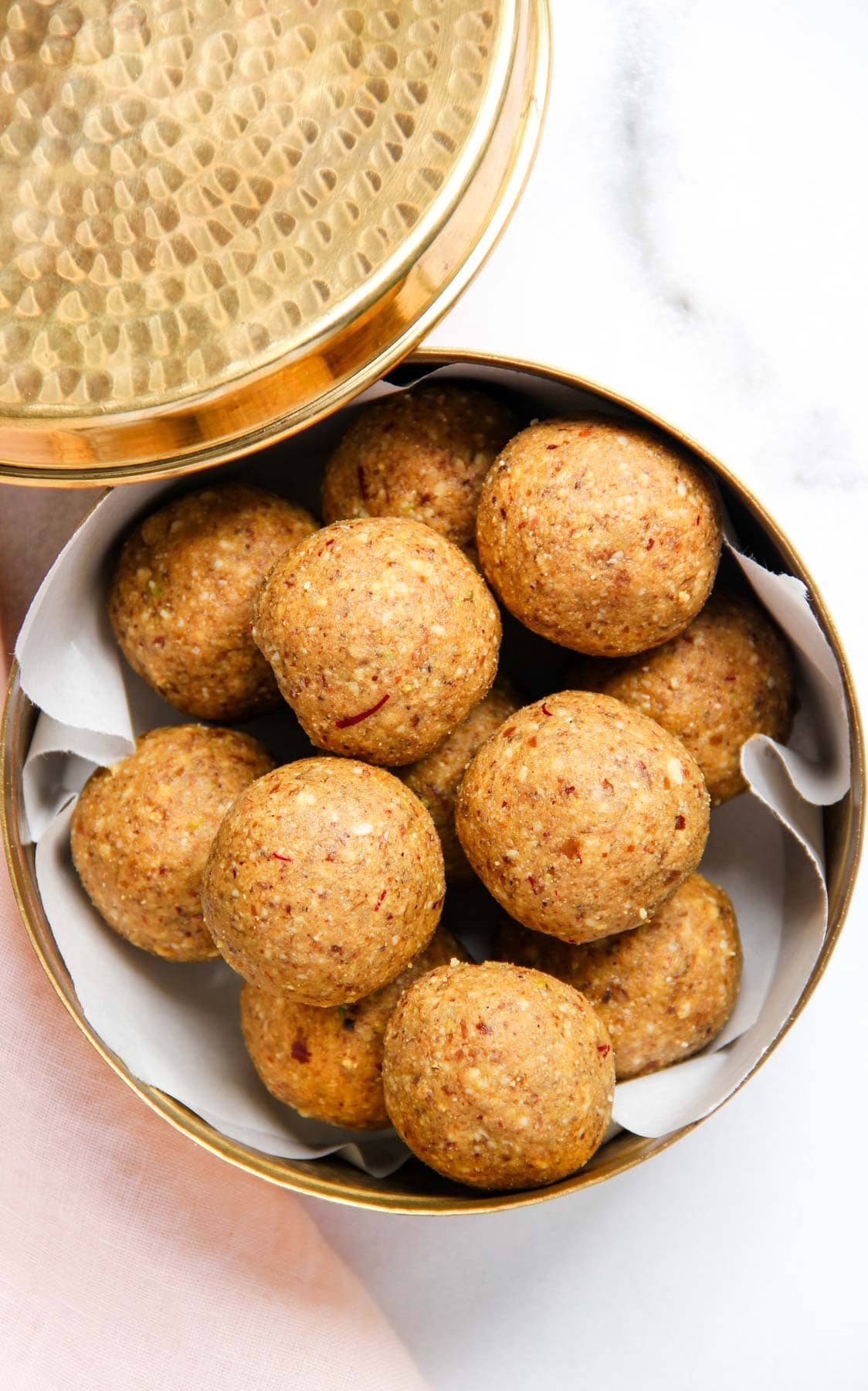 sattu laddu in a metal container.