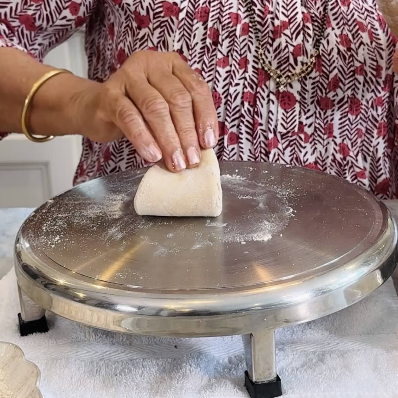 Triangle-folded dough, ready to be rolled into chapati.