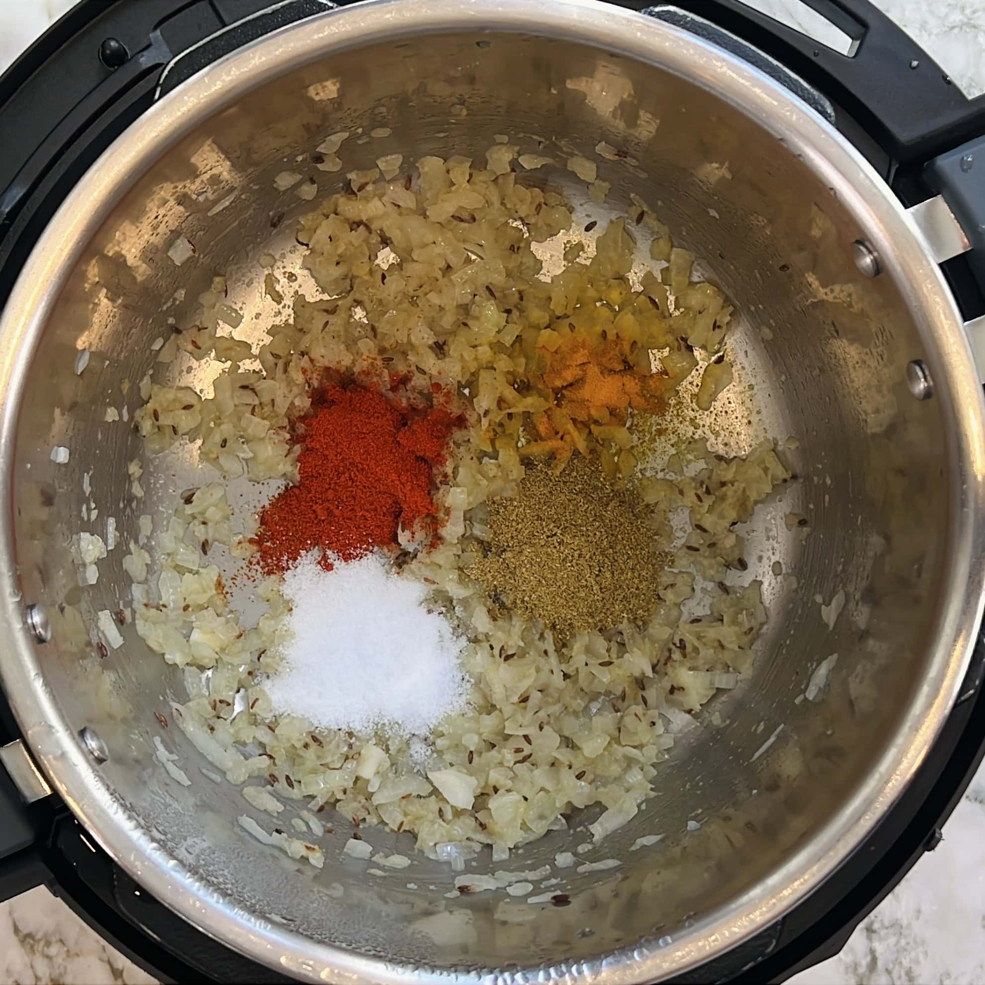 onions and spices sauteed in the Instant Pot.