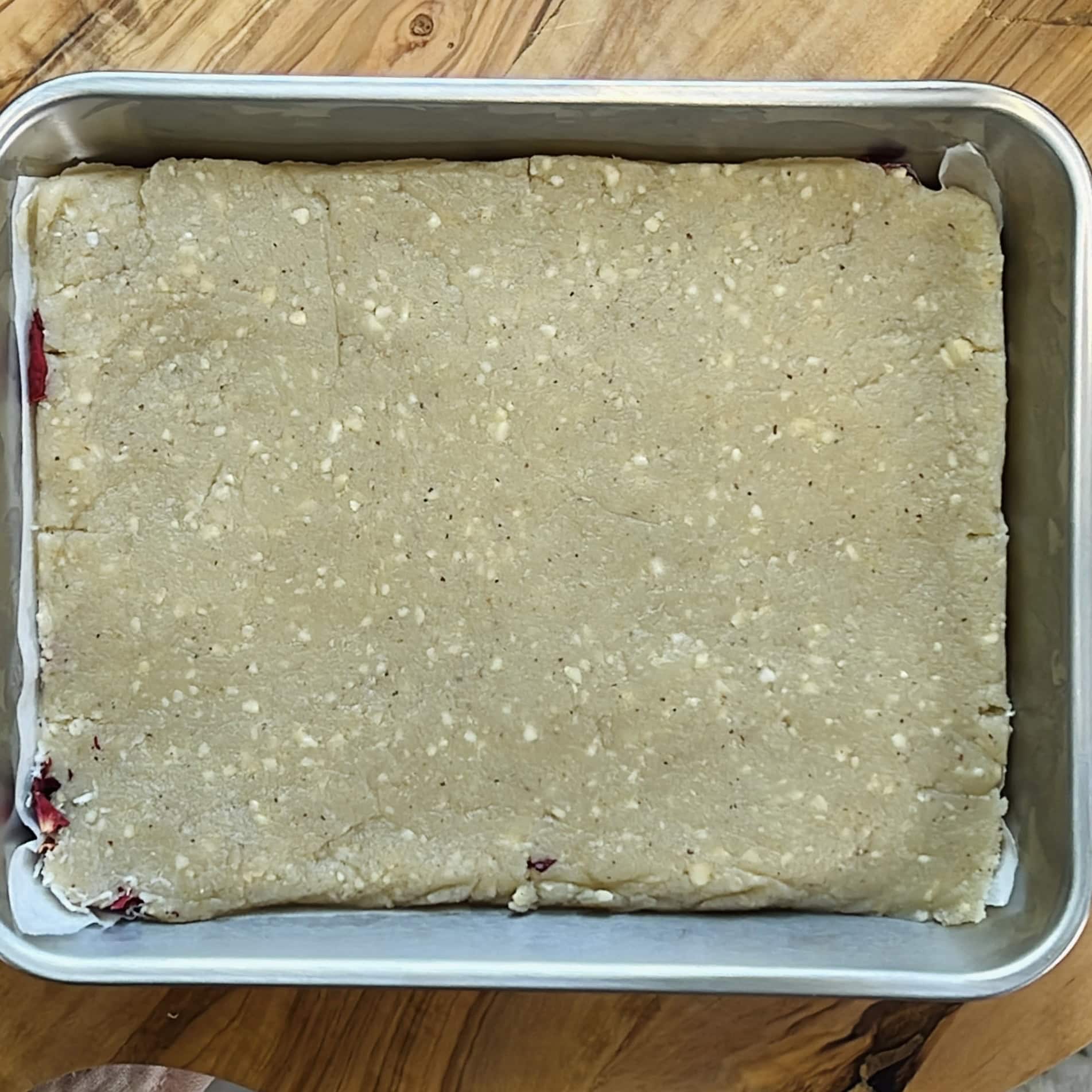 burfi pressed in a baking tray. 