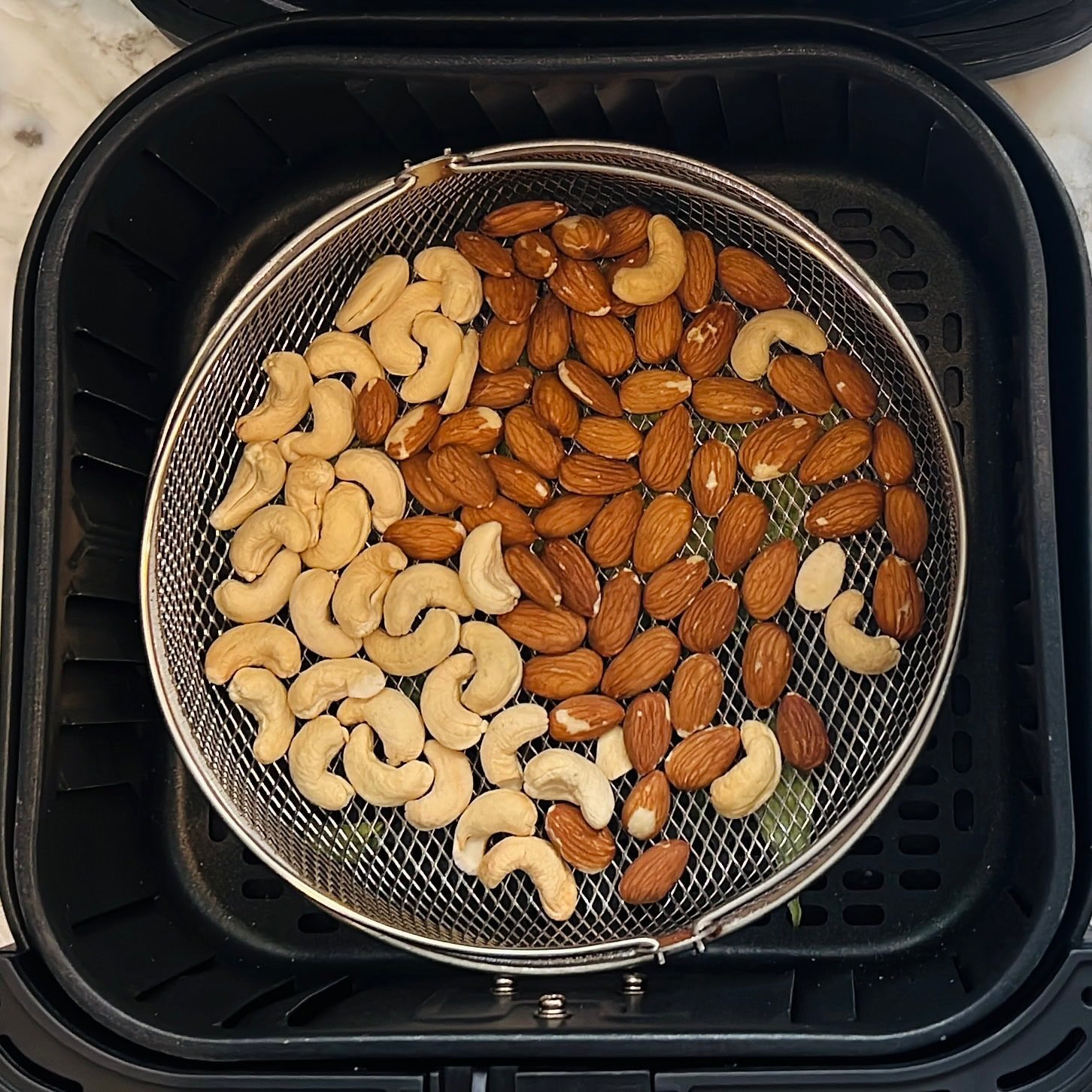 nuts inside airfryer basket.