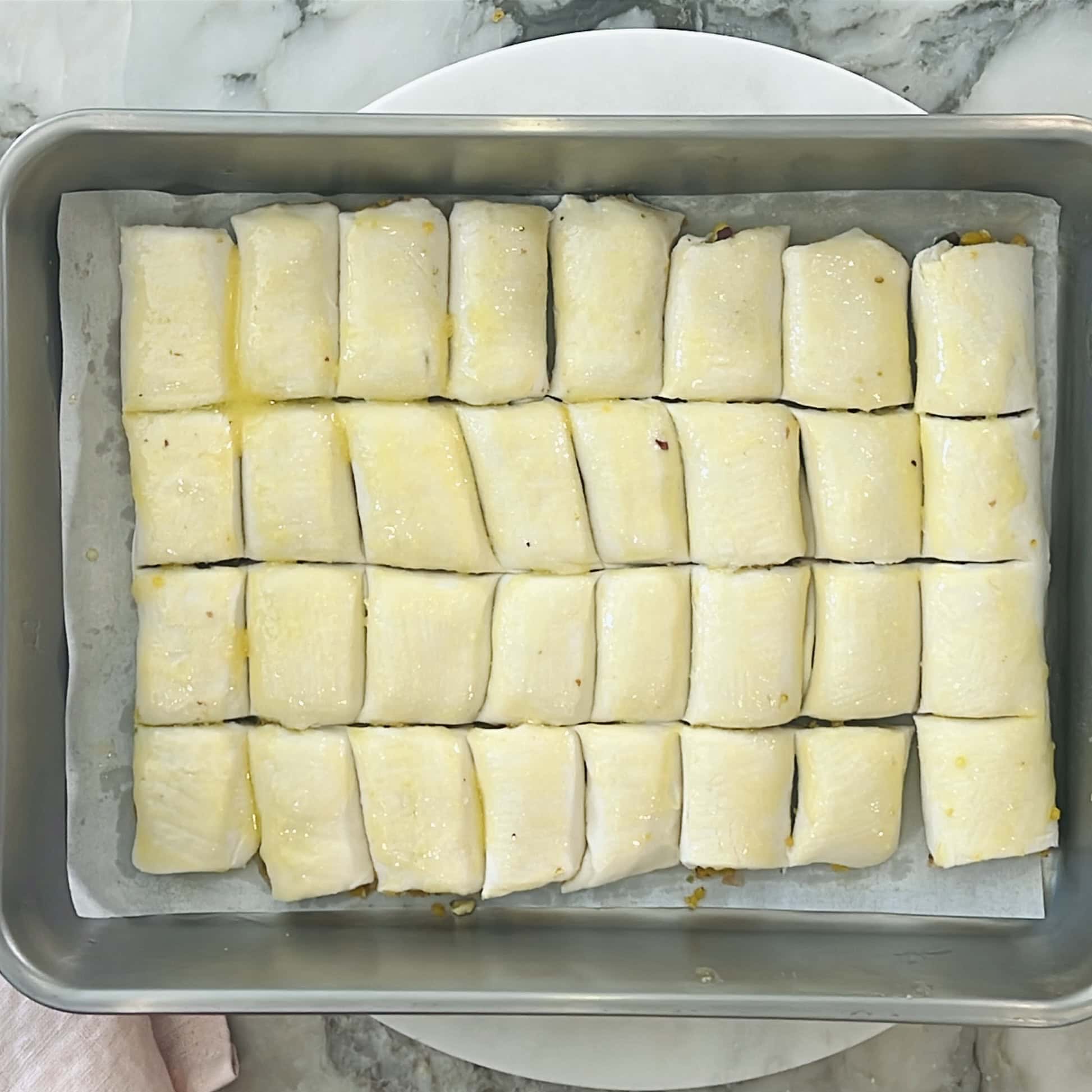 pastry sqaures brushed with ghee.