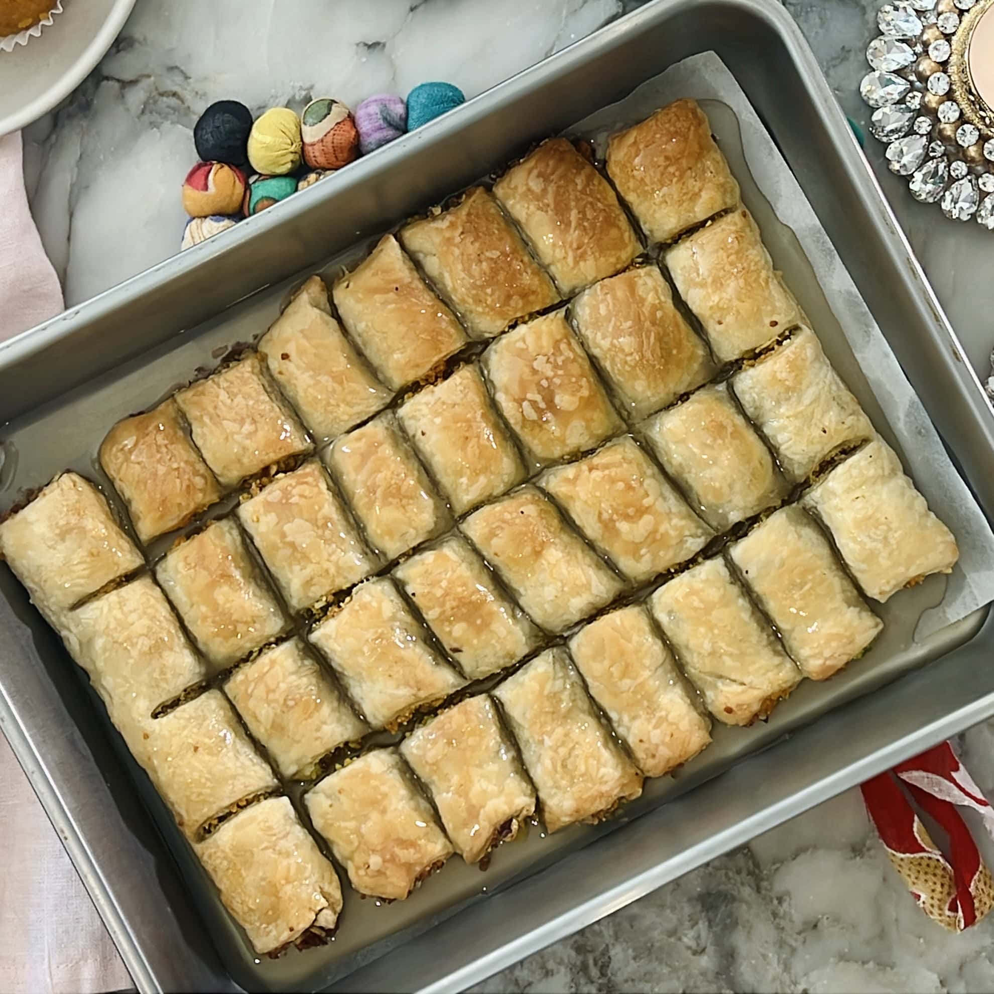 syrup poured on baked pastry sqaures.