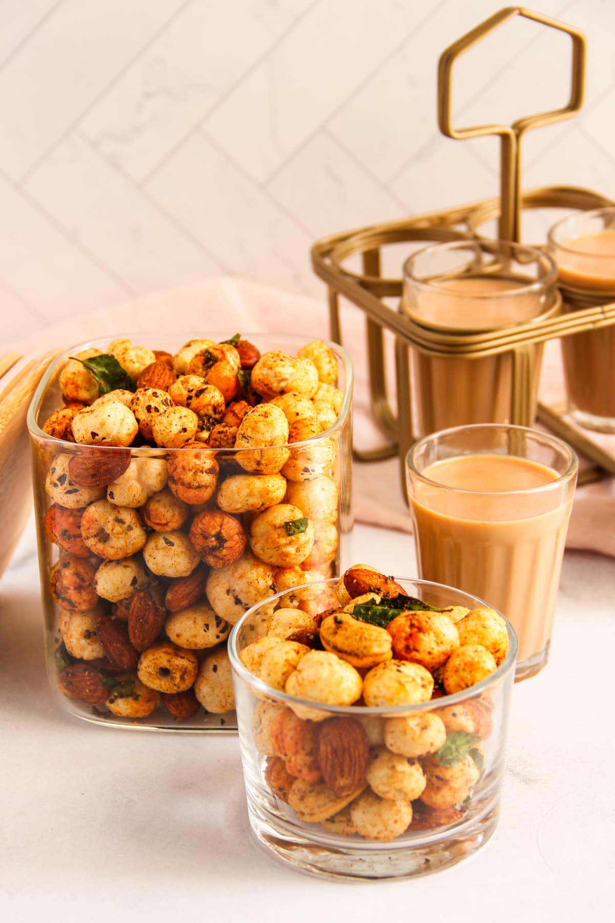 Makhana Chivda in glass jars served with chai.