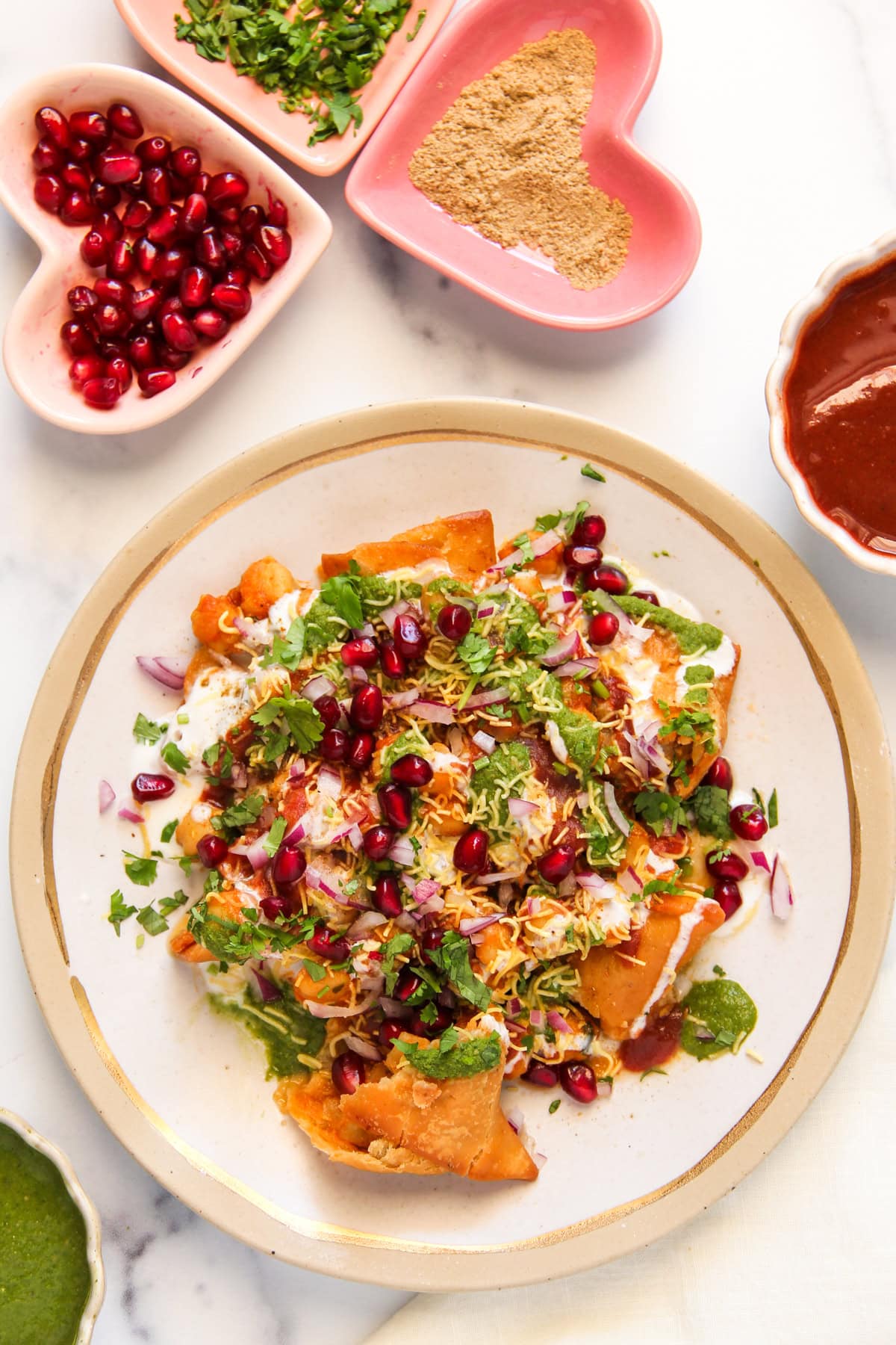 assembled samosa chaat in a plate.