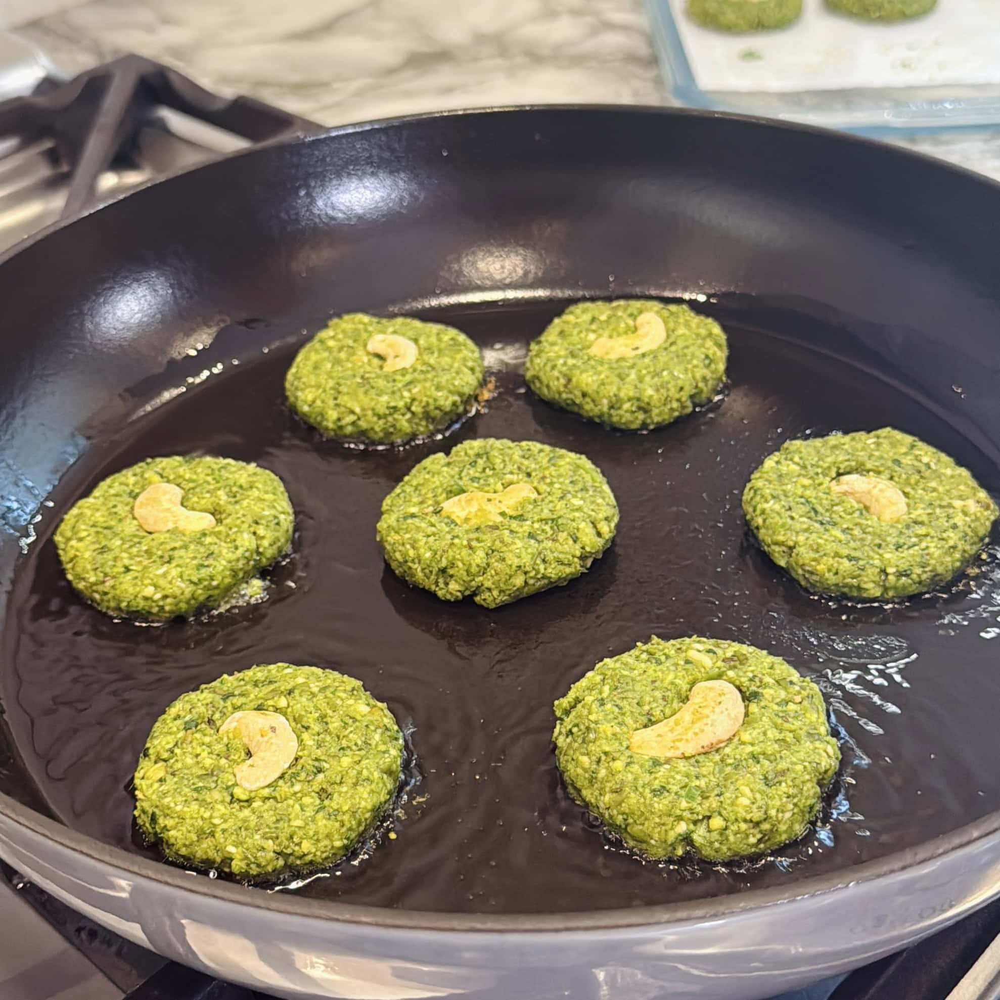 mung bean tikki in a pan.