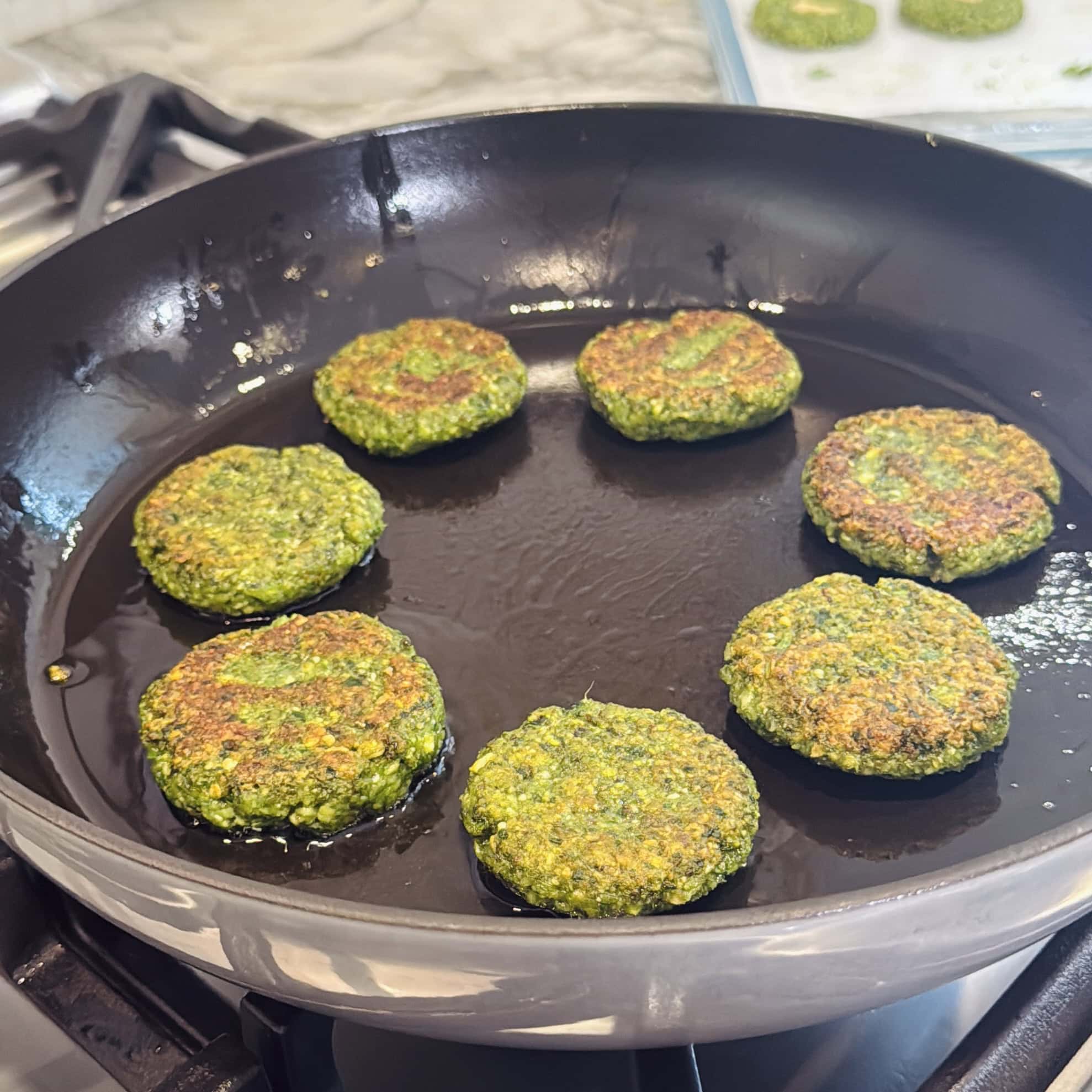 cooked mung bean tikki in a pan.
