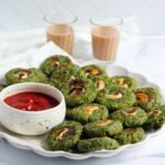 moong bean tikki served with ketchup and chai.