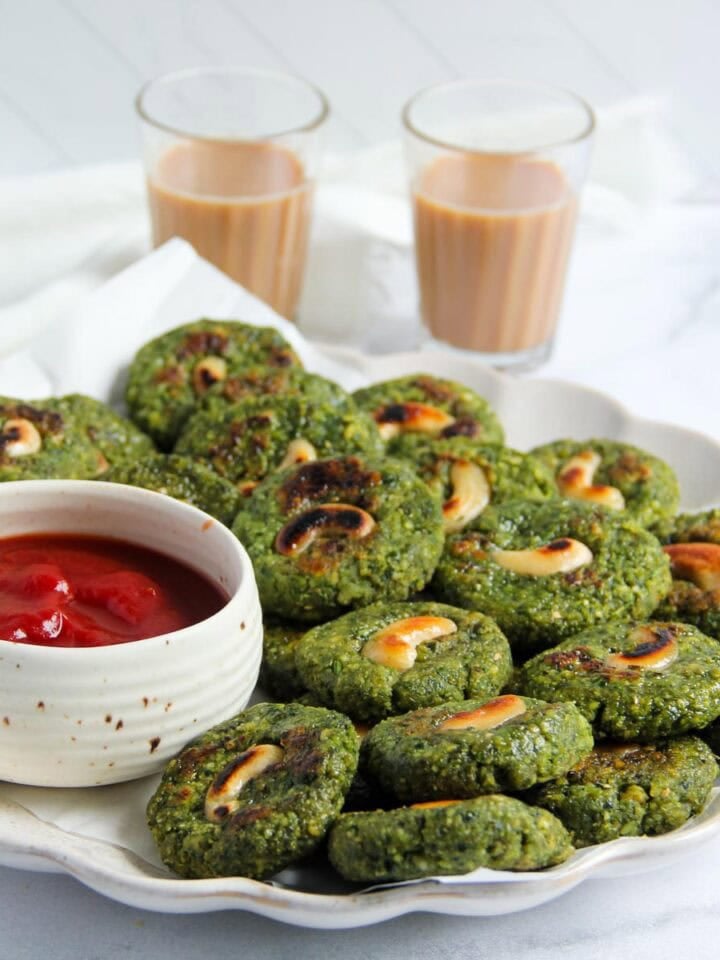 moong bean tikki served with ketchup and chai.