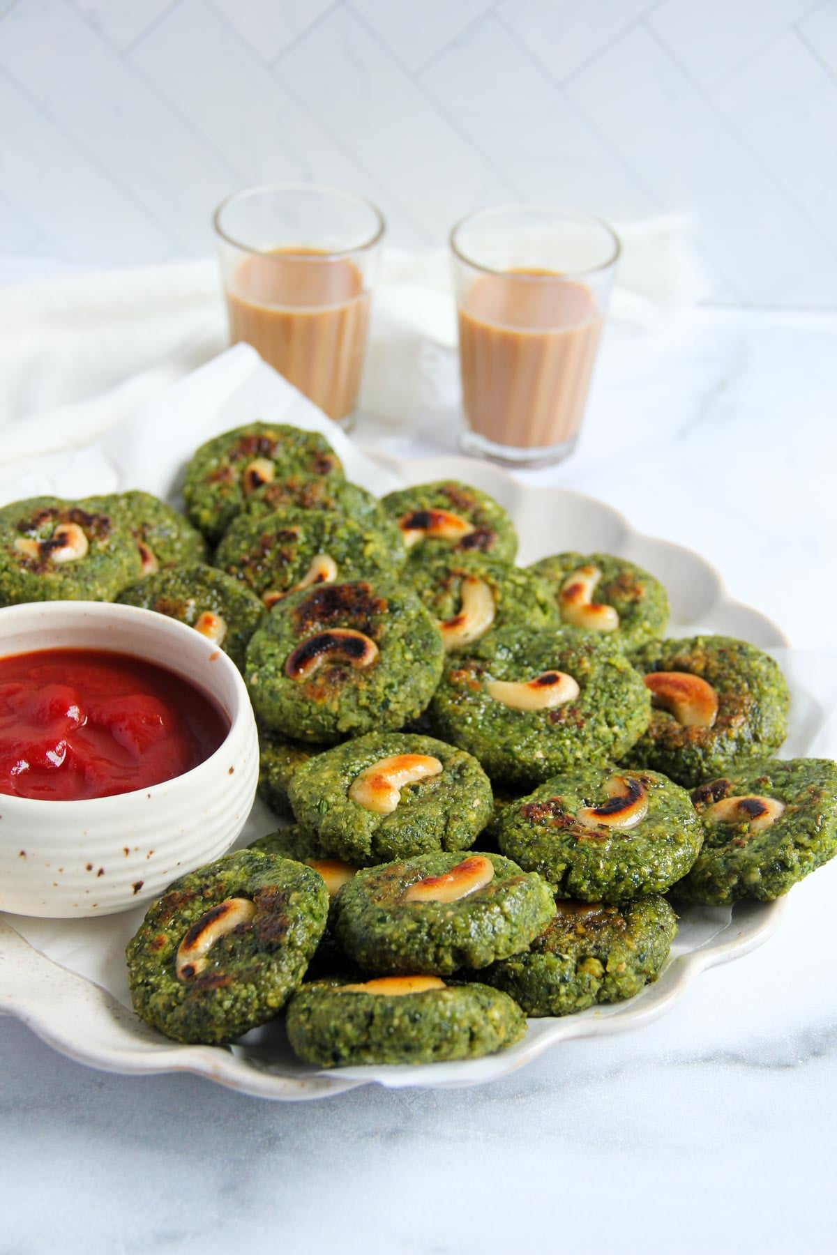 whole moong bean tikki served with ketchup with chai.