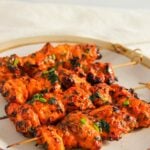 A plate of chicken skewers.